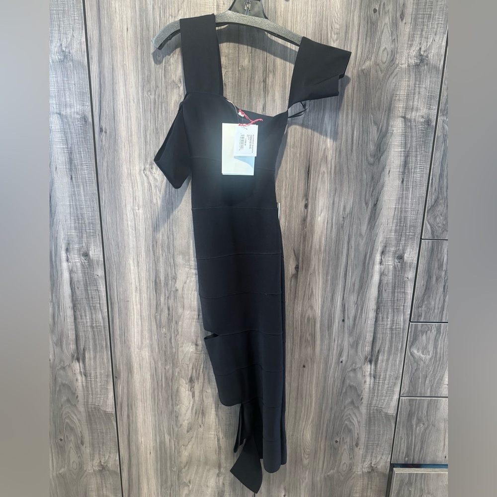 Alexander McQueen's black bandage dress is shaped for a snug bandage-inspired